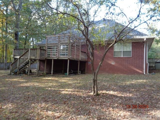 rear view of house featuring a deck with mountain view