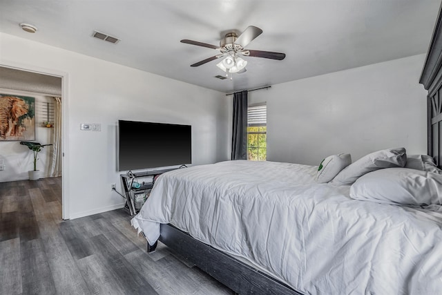 bedroom featuring dark hardwood / wood-style flooring and ceiling fan