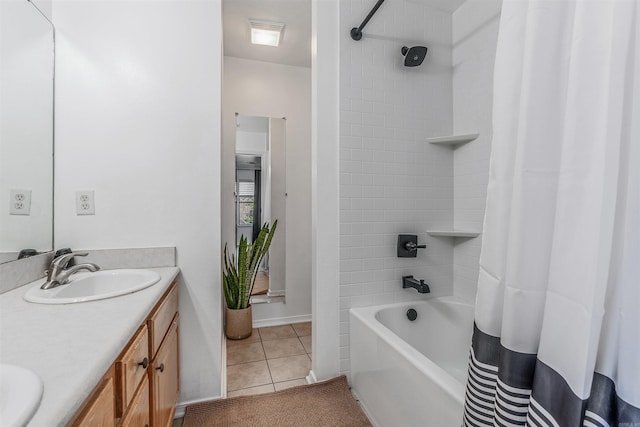 bathroom with tile patterned flooring, vanity, and shower / bath combo with shower curtain