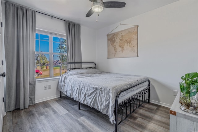 bedroom featuring wood-type flooring and ceiling fan