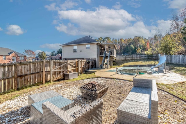 view of patio with a fire pit