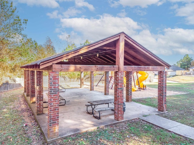 view of community featuring a yard and a patio