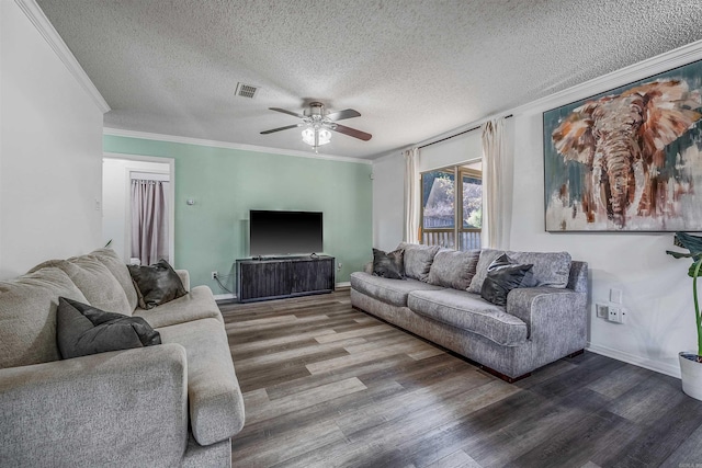 living room featuring ceiling fan, hardwood / wood-style floors, crown molding, and a textured ceiling