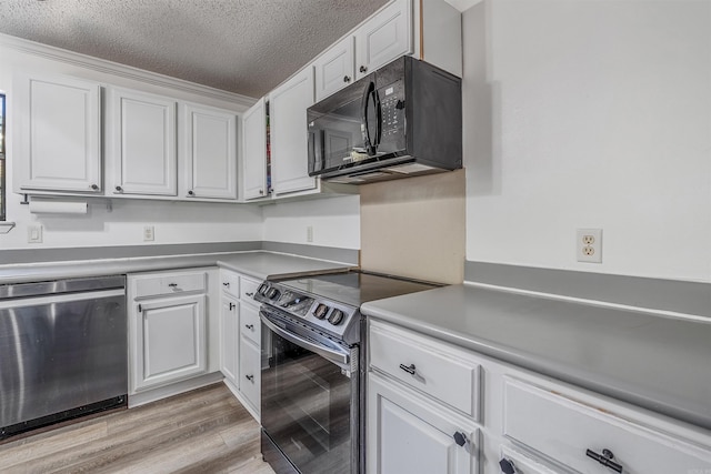 kitchen featuring a textured ceiling, light hardwood / wood-style floors, white cabinetry, and black appliances