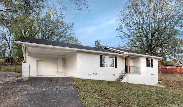 ranch-style home with a carport