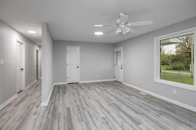 spare room with ceiling fan and light hardwood / wood-style floors