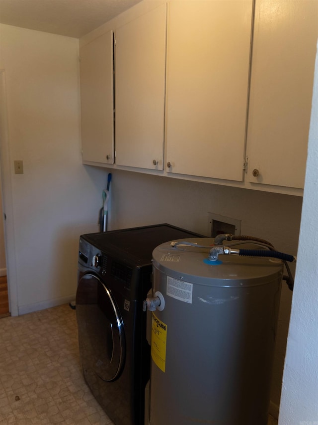 washroom with cabinets and water heater