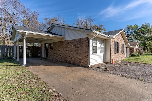 view of home's exterior with a carport