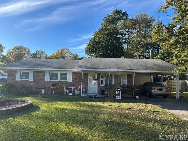 single story home with a carport and a front yard