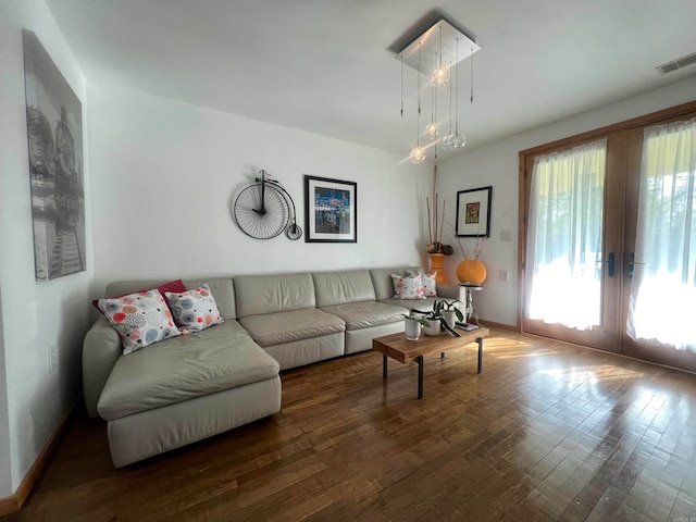 living room featuring french doors and dark hardwood / wood-style floors