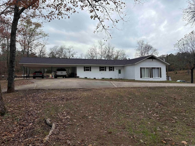 single story home featuring a carport