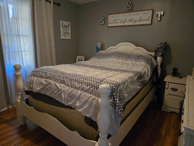 bedroom featuring dark hardwood / wood-style flooring