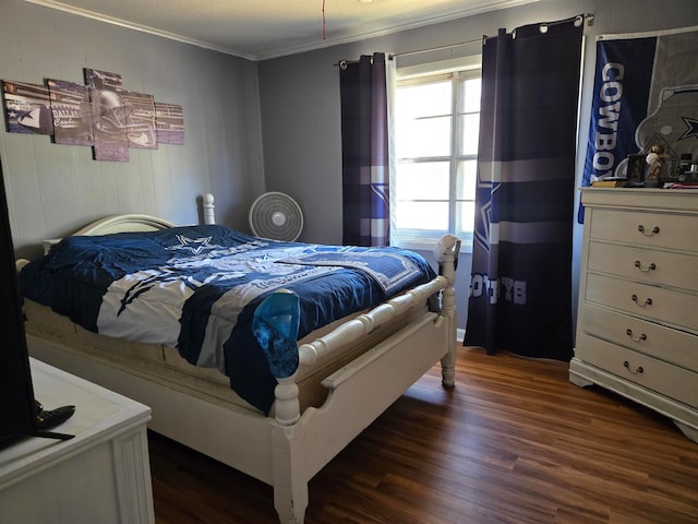 bedroom featuring dark hardwood / wood-style flooring and crown molding