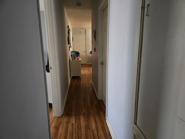 hall featuring dark hardwood / wood-style floors