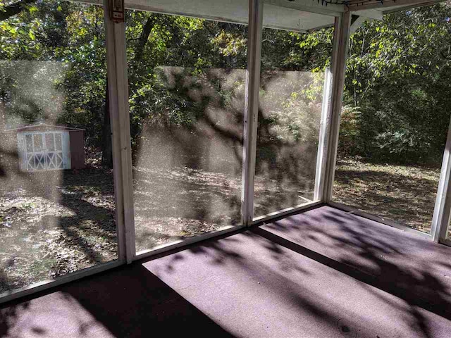 unfurnished sunroom featuring a wealth of natural light