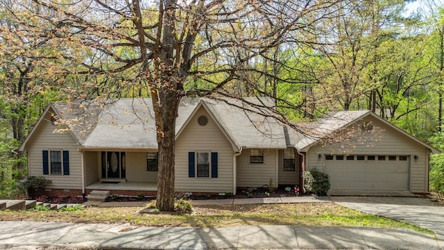 view of front of house with covered porch and a garage