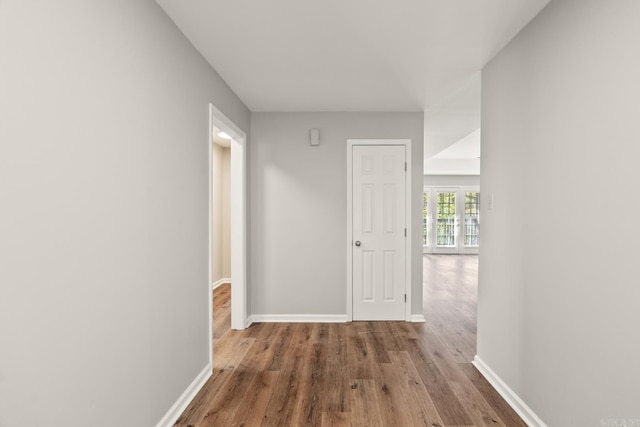 corridor featuring hardwood / wood-style flooring