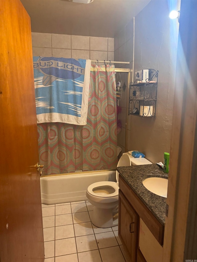 full bathroom featuring toilet, shower / bath combination with curtain, vanity, and tile patterned floors