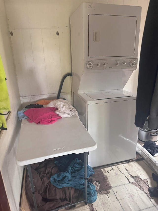 laundry area featuring stacked washer and dryer