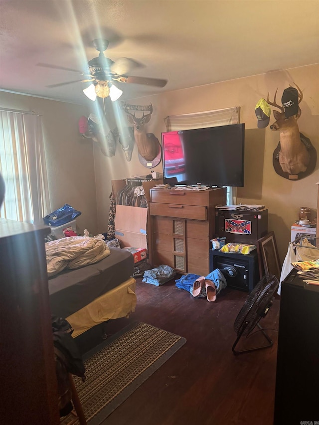 bedroom with wood-type flooring and ceiling fan