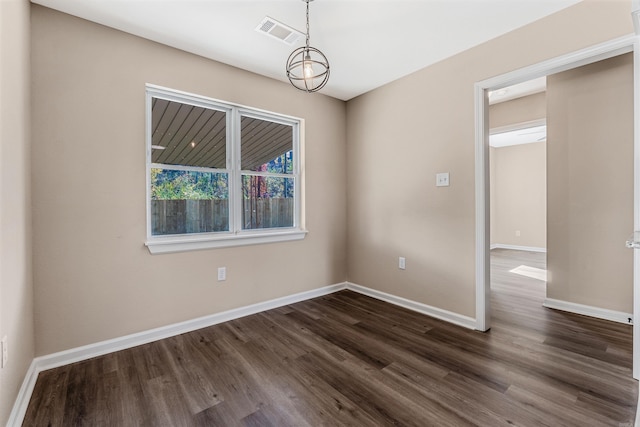 spare room with dark wood-type flooring