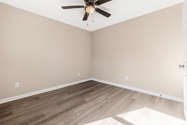 unfurnished room with ceiling fan and wood-type flooring