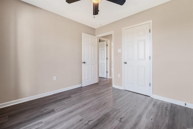 unfurnished bedroom featuring a closet, ceiling fan, and hardwood / wood-style floors