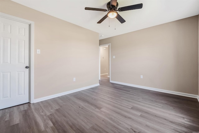 empty room featuring hardwood / wood-style floors and ceiling fan