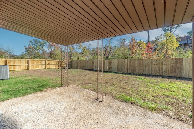 view of yard featuring a patio area and central AC unit