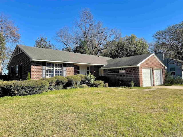 ranch-style home with a front yard and a garage