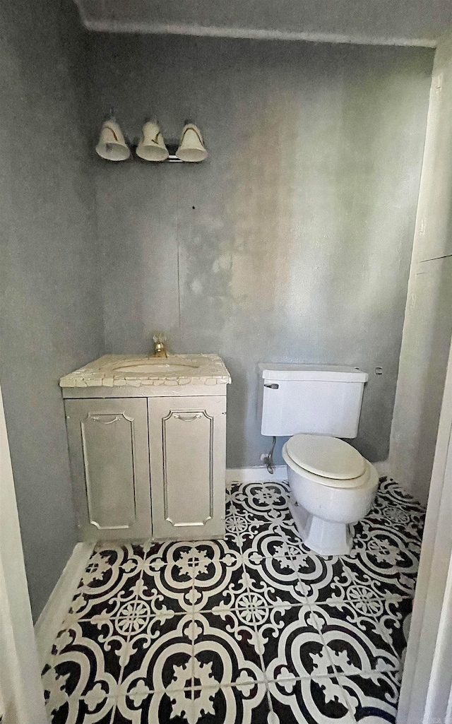 bathroom with tile patterned floors, sink, and toilet