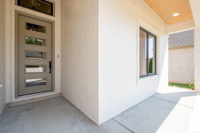 view of exterior entry featuring a porch