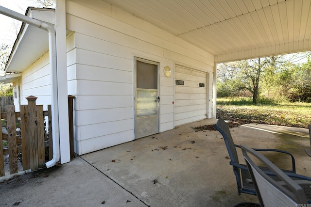 view of patio featuring a garage