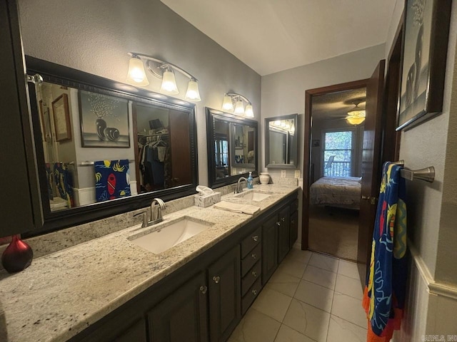 bathroom with tile patterned flooring and vanity