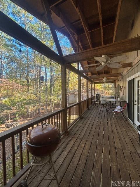 wooden terrace featuring ceiling fan