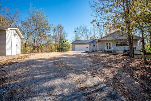 view of front of home featuring a garage and covered porch