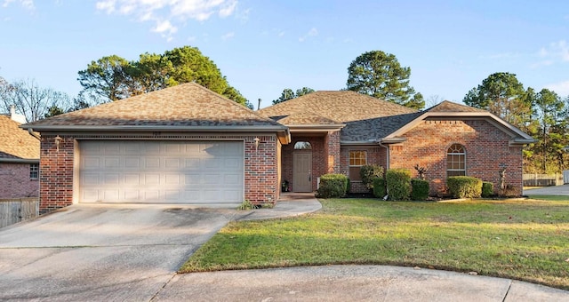 ranch-style home featuring a garage and a front lawn