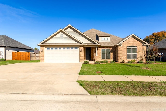 view of front facade with a garage and a front yard