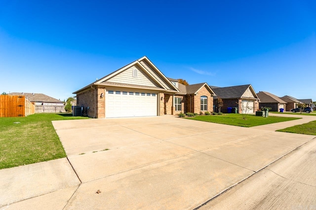 ranch-style house featuring a front lawn and a garage