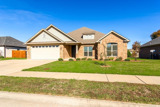 craftsman-style home with a garage and a front lawn