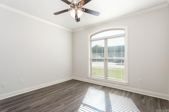 unfurnished room featuring dark hardwood / wood-style flooring, a wealth of natural light, and ornamental molding