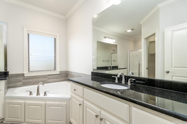 bathroom featuring crown molding, vanity, and shower with separate bathtub