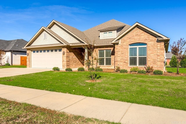 craftsman inspired home featuring a garage and a front yard