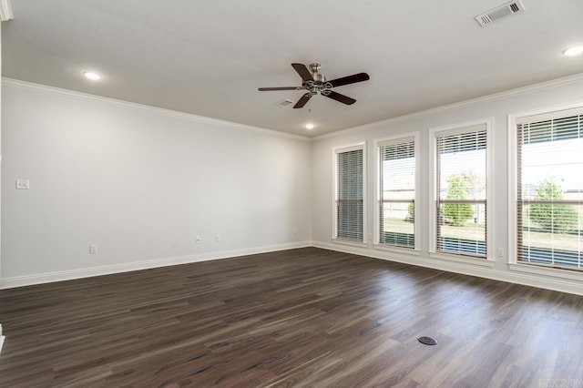 empty room featuring dark hardwood / wood-style floors, ceiling fan, and crown molding