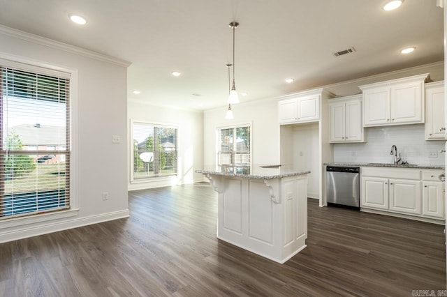 kitchen with white cabinetry, dishwasher, hanging light fixtures, dark hardwood / wood-style floors, and a kitchen island