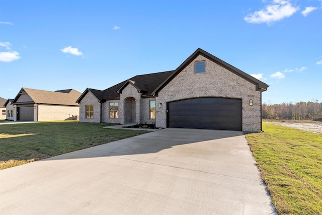 french country inspired facade featuring a garage and a front lawn