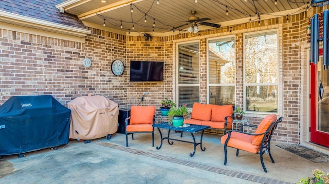 view of patio with ceiling fan, a grill, and an outdoor hangout area