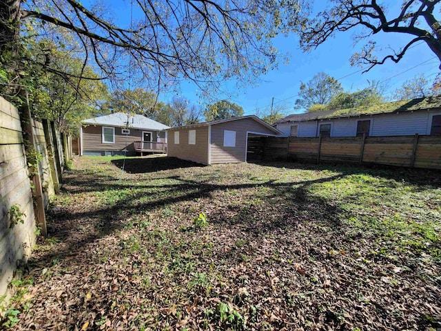 view of yard featuring a wooden deck