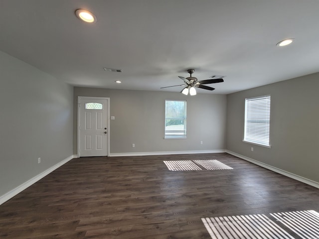 foyer with dark hardwood / wood-style floors and ceiling fan