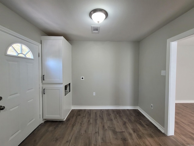 foyer with dark hardwood / wood-style floors